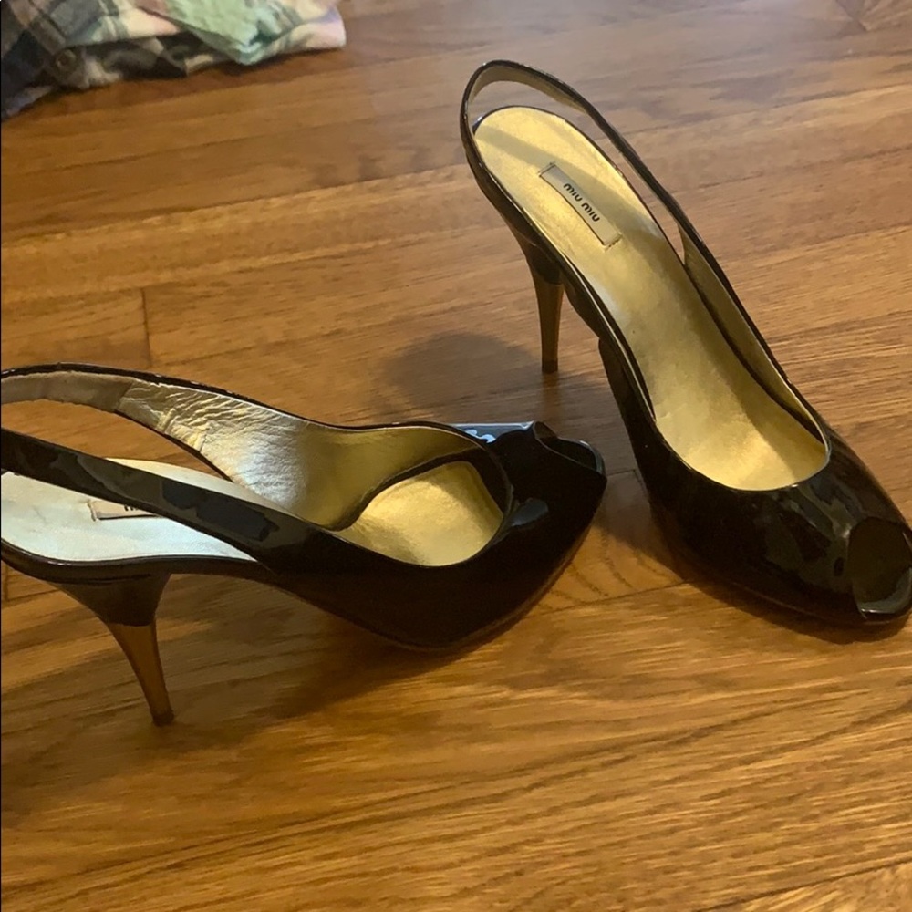 Mui Mui black and gold stilettos